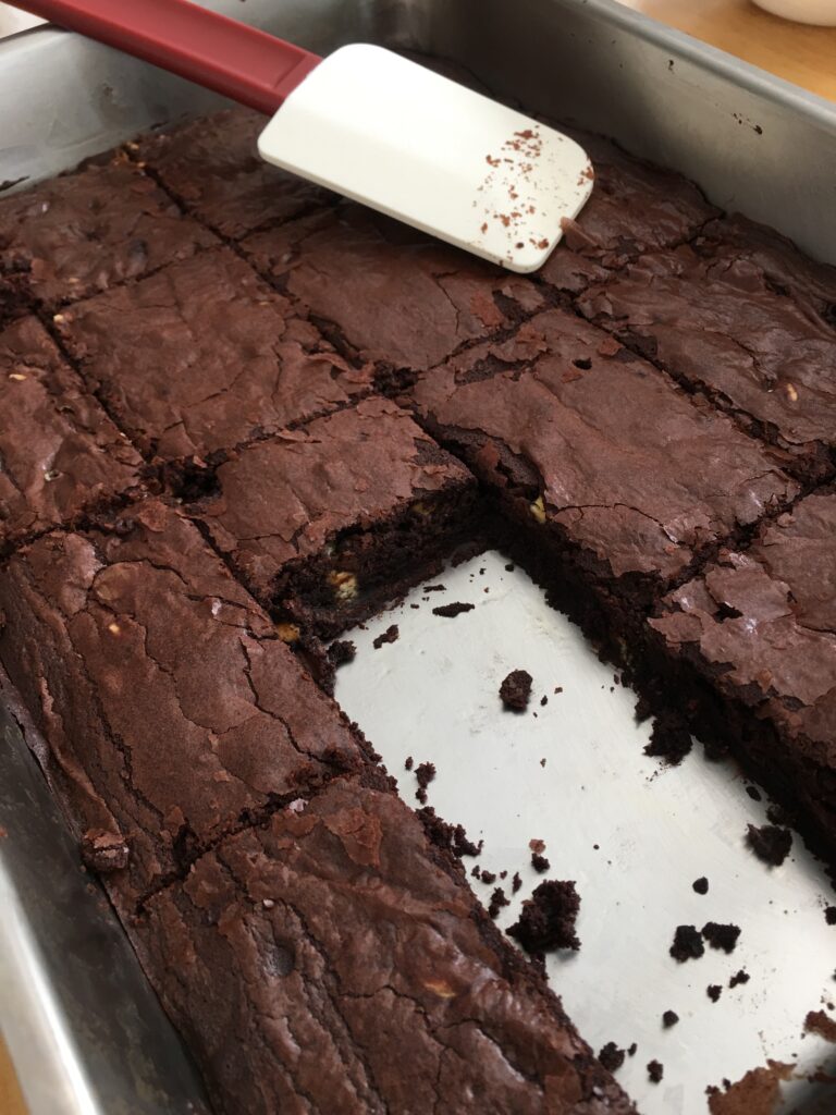Baked brownies with missing two slices. 