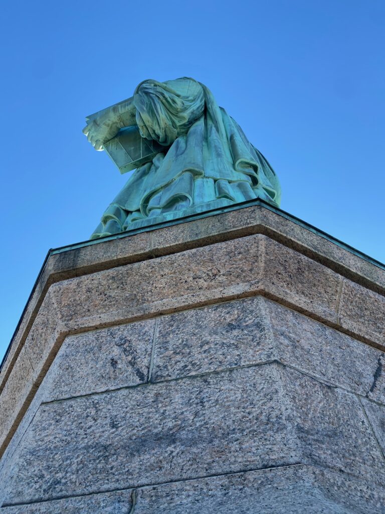 Homeschool Field Trip Guide Statue of Liberty National Monument Holding a Book